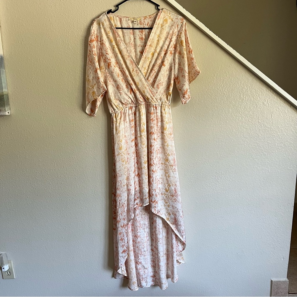 Wrap Maxi Orange and white floral midi dress with a flowy, asymmetrical design
